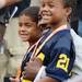 ESPN's "College GameDay" host Desmond Howard smiles as he sits with his sons during a live broadcast at Ingalls Mall on the University of Michigan campus on Saturday, September 7, 2013. Melanie Maxwell | AnnArbor.com